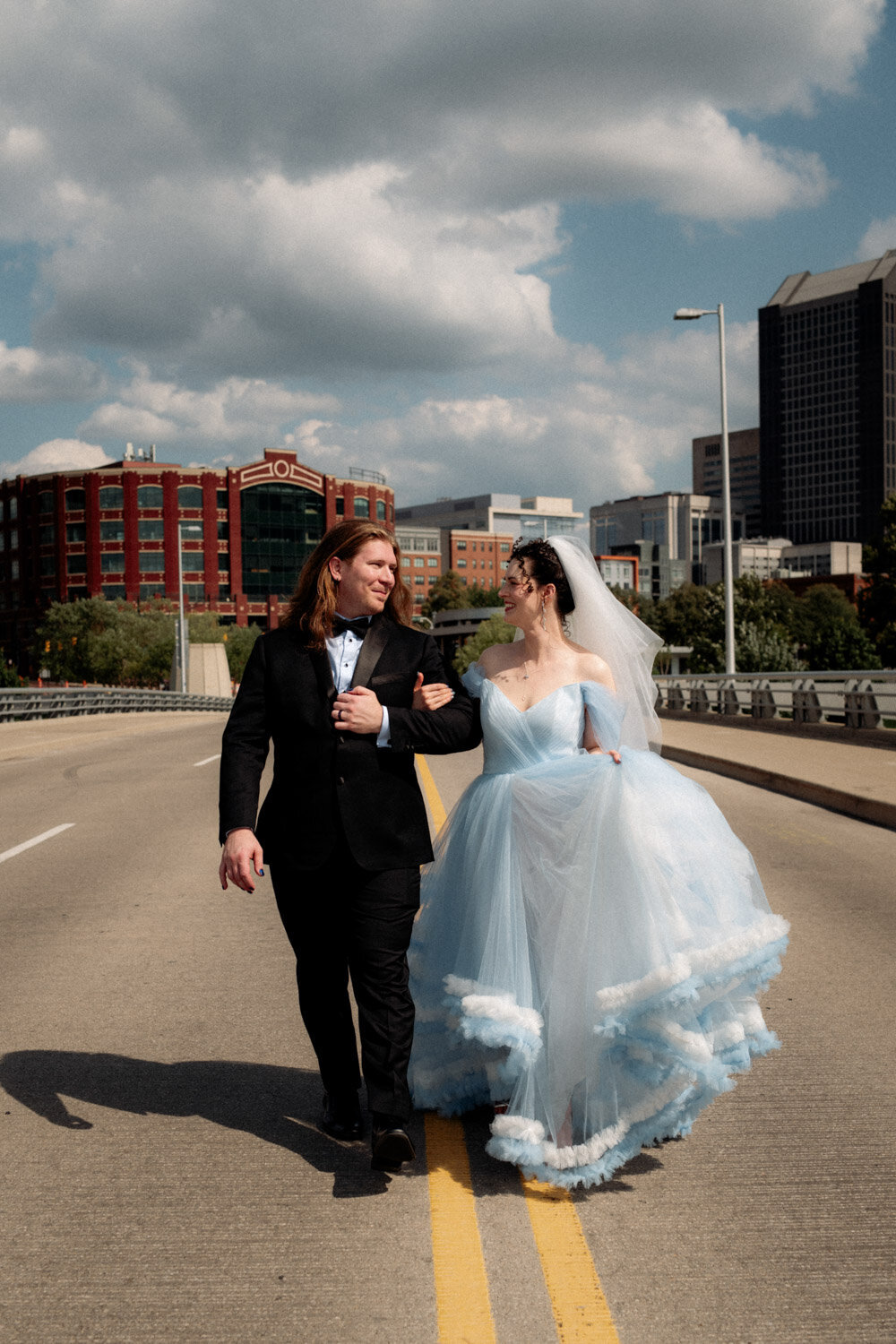 Walking couple in downtown columbus by Paige Mireles