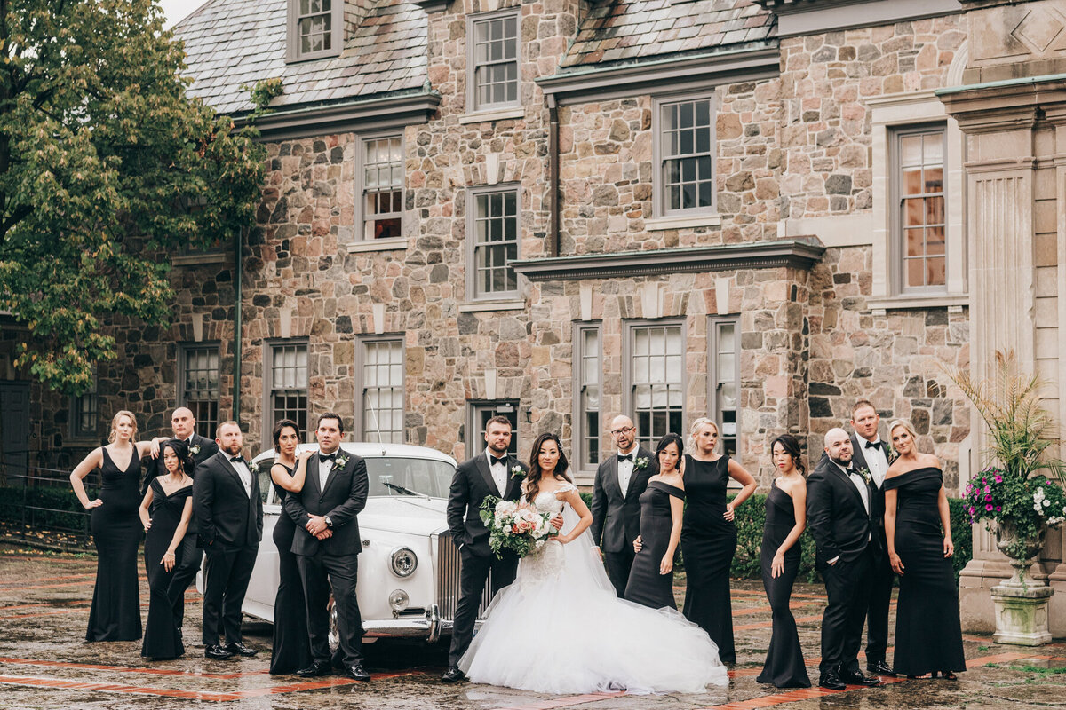 Glamorous wedding party portraits with Rolls Royce