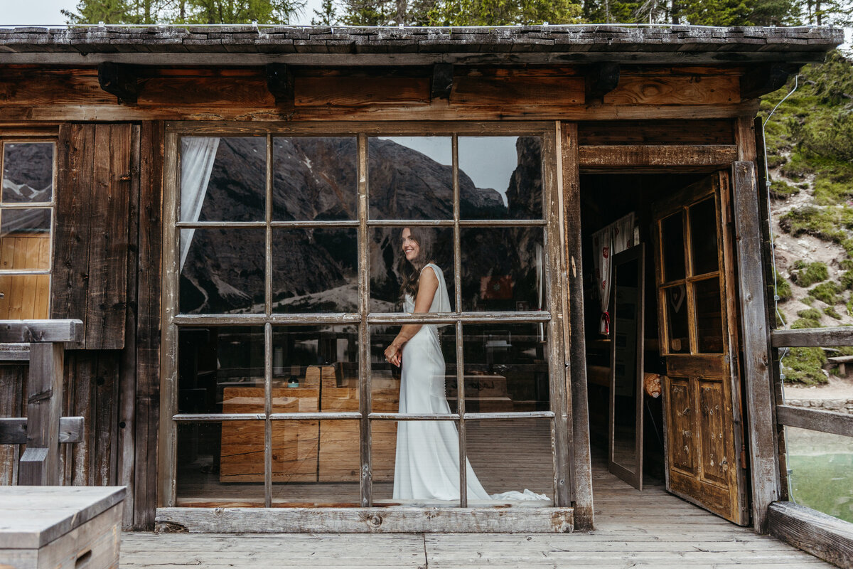 pretty bride in dolomites lake Braies elopement