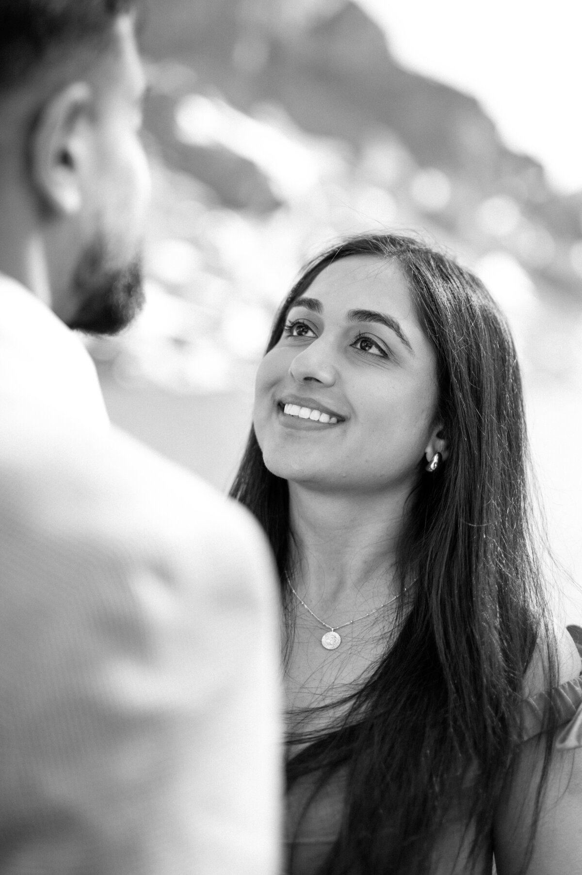 Man and woman looking at each other after their engagement.