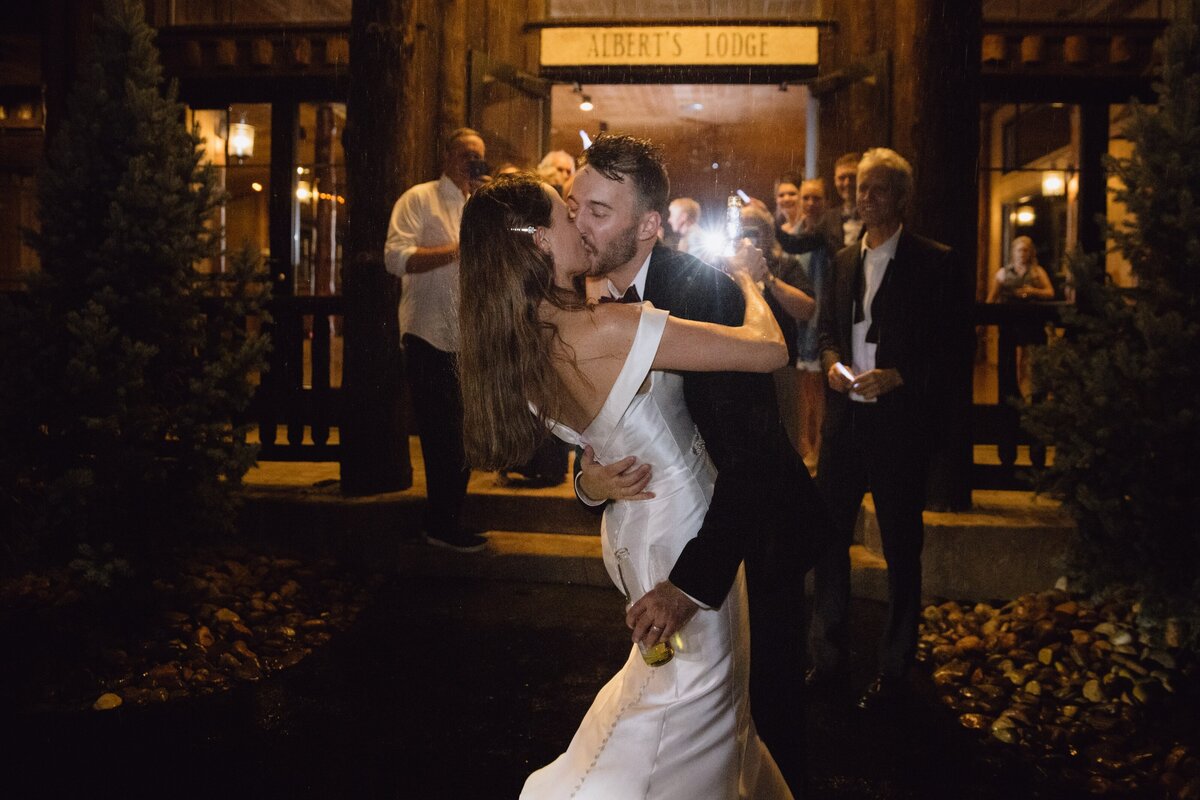 Bride and groom share a kiss on their wedding day at Spruce Mountain Ranch.