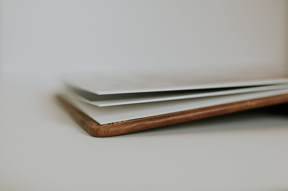Close-up of wedding album spine and pages