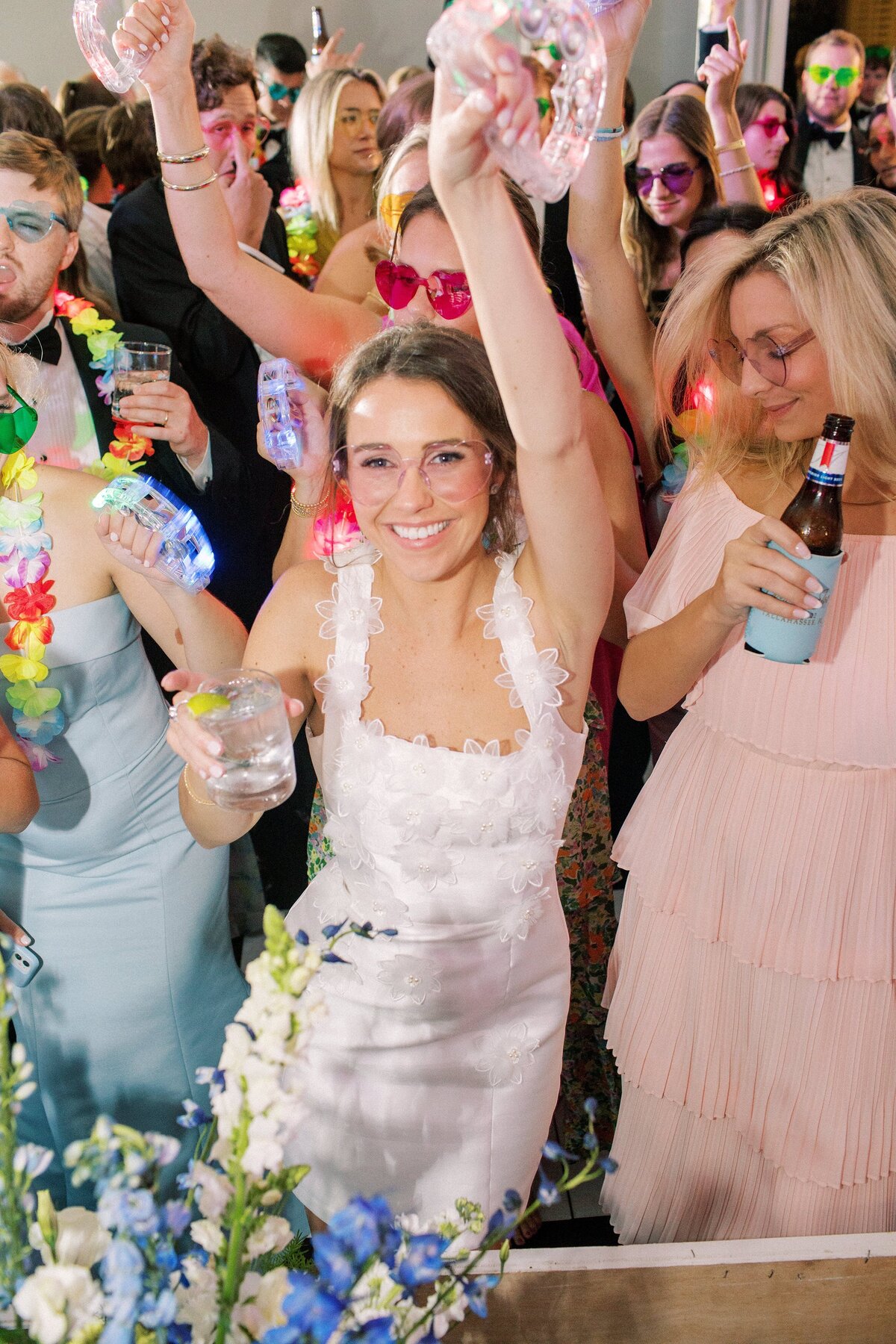 Bride dances with friends at her wedding reception
