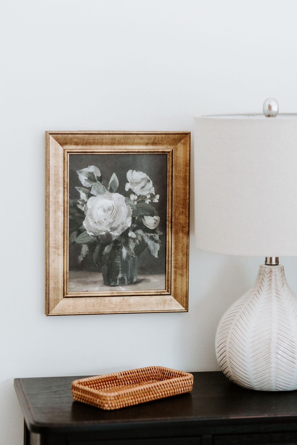 Studio McGee for Threshold at Target artwork on the wall with a black  nightstand  in the gold bedroom of the modern farmhouse overnight accommodation at Willowbrook wedding venue