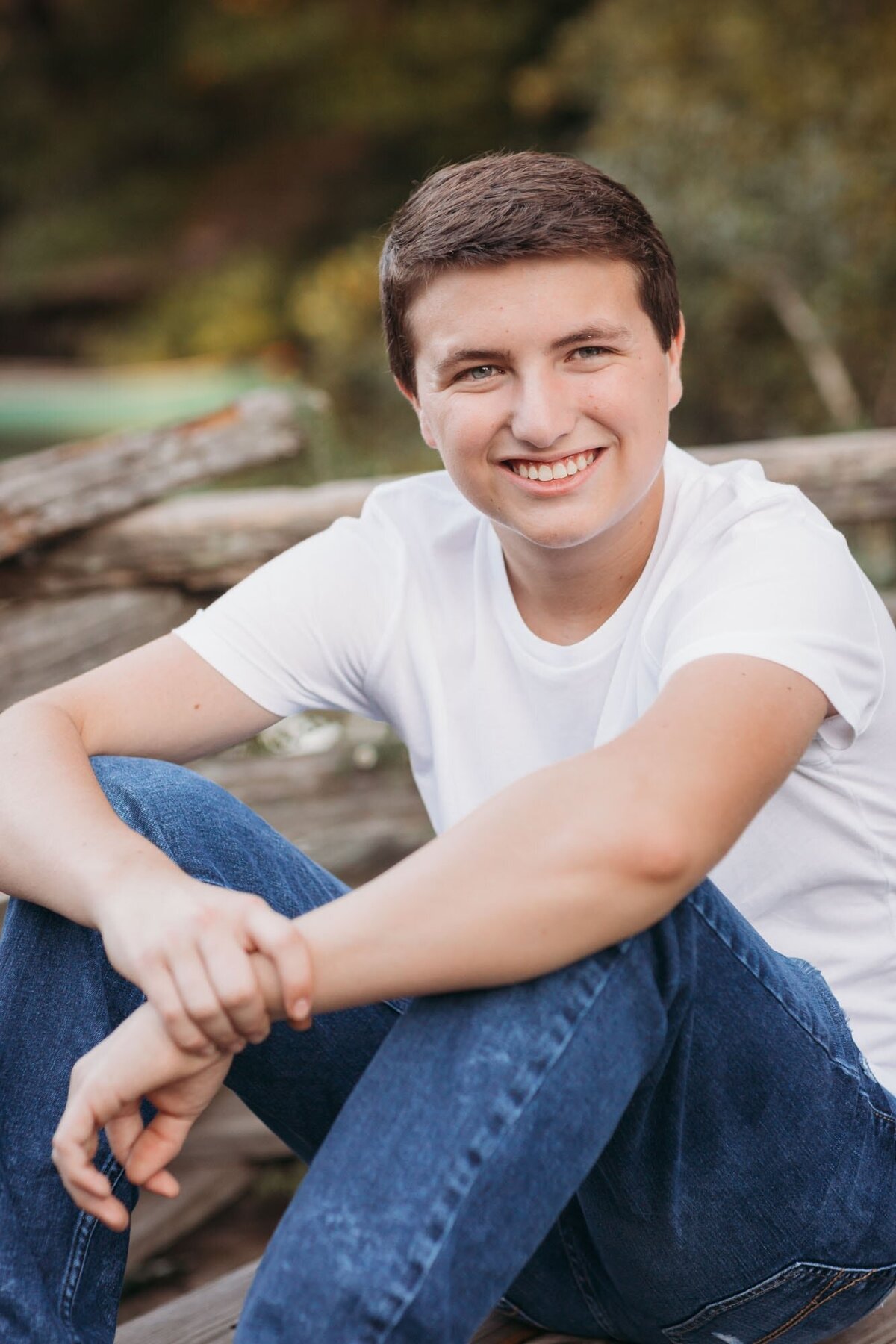 Smiling boy ready for graduation and his senior portraits.