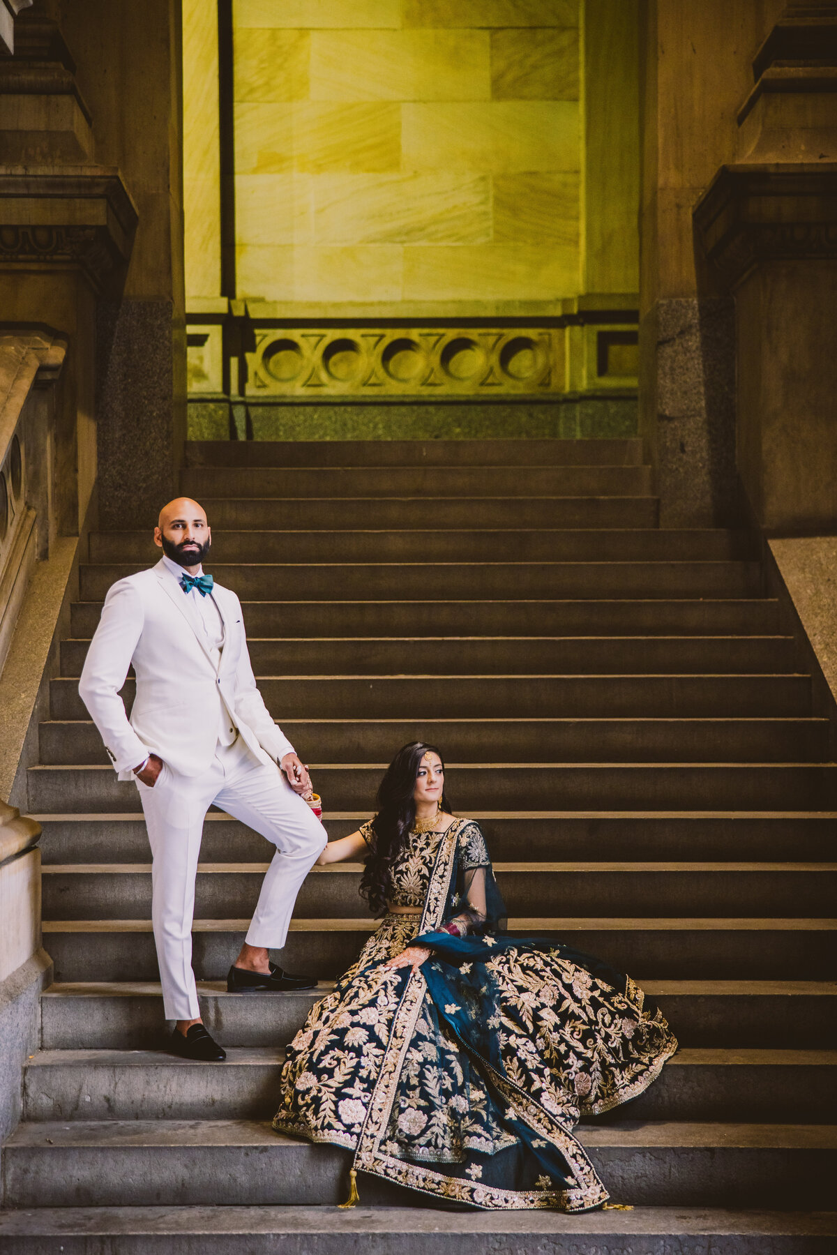 south asian sikh wedding couple on the stairs at the philadelphia city hall before the reception