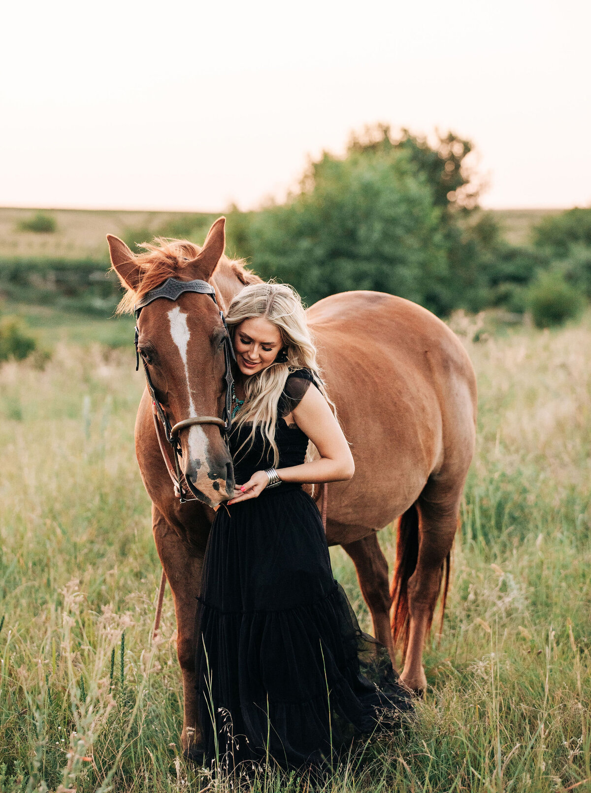 girl in black dress with horse