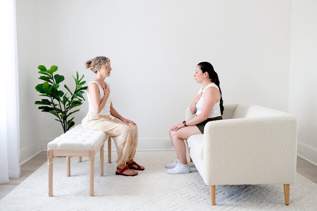 Boston nutrition and somatic experiencing therapist in session with another woman.