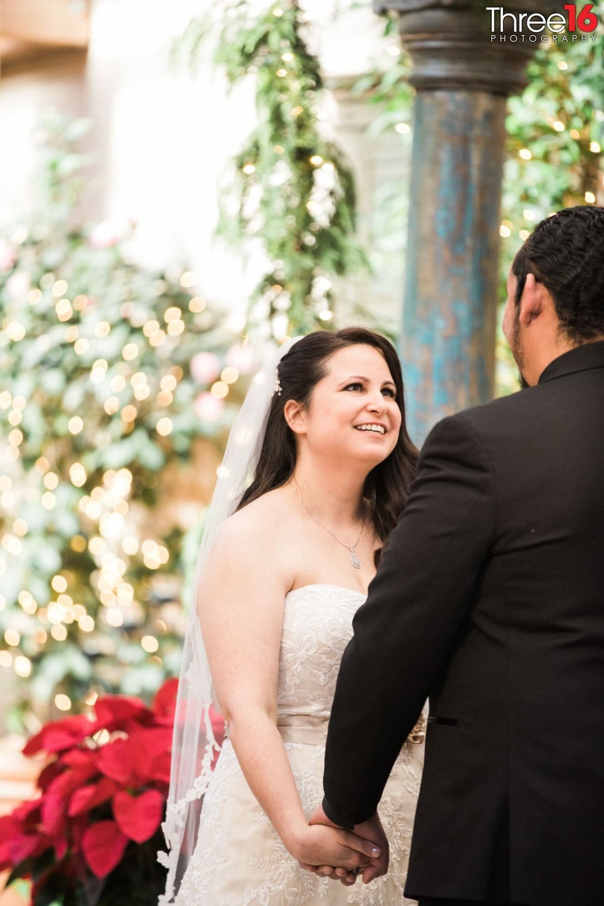 Bride smiles at her Groom during the ceremony