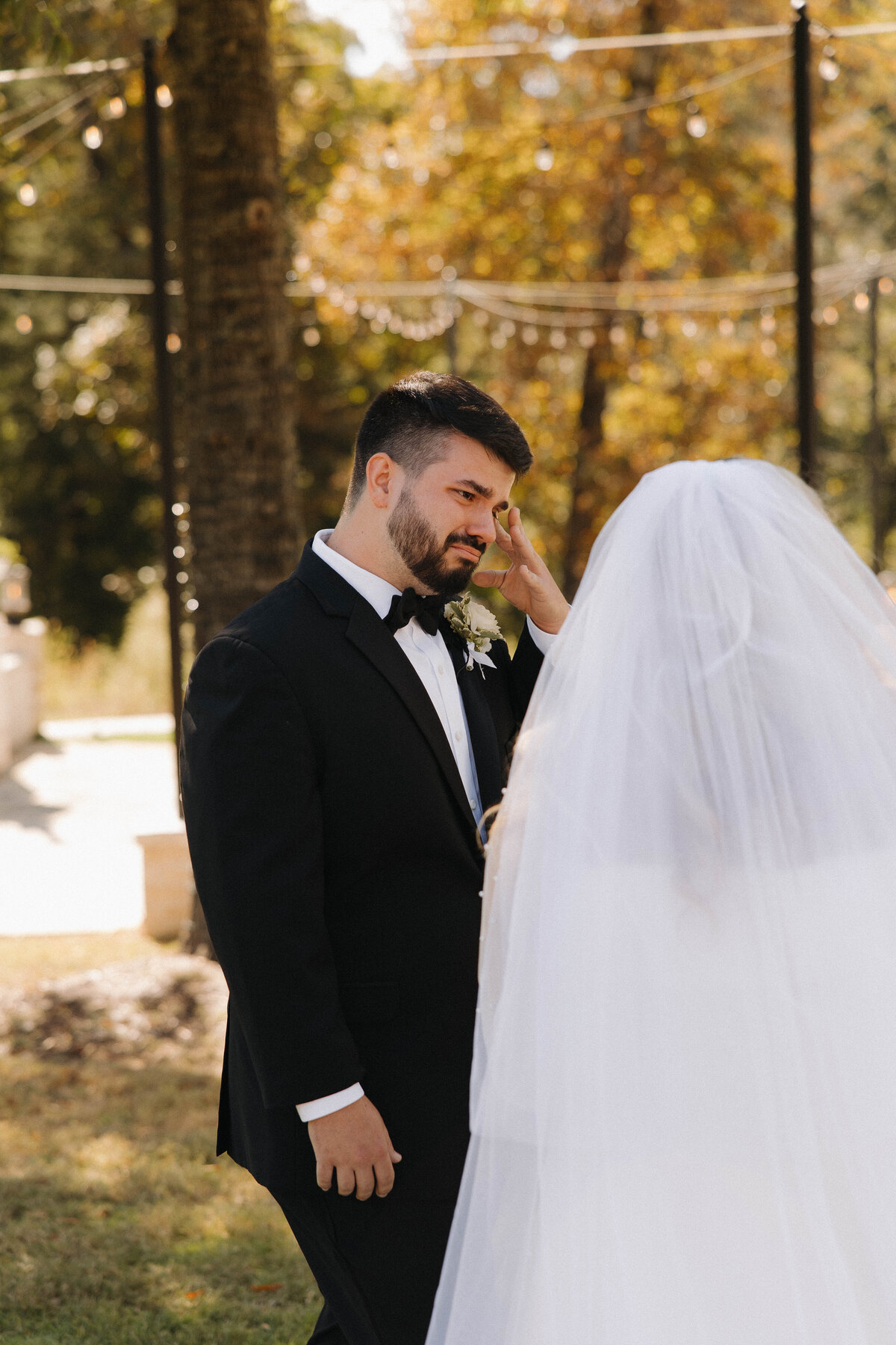 Emotional groom during first look with bride