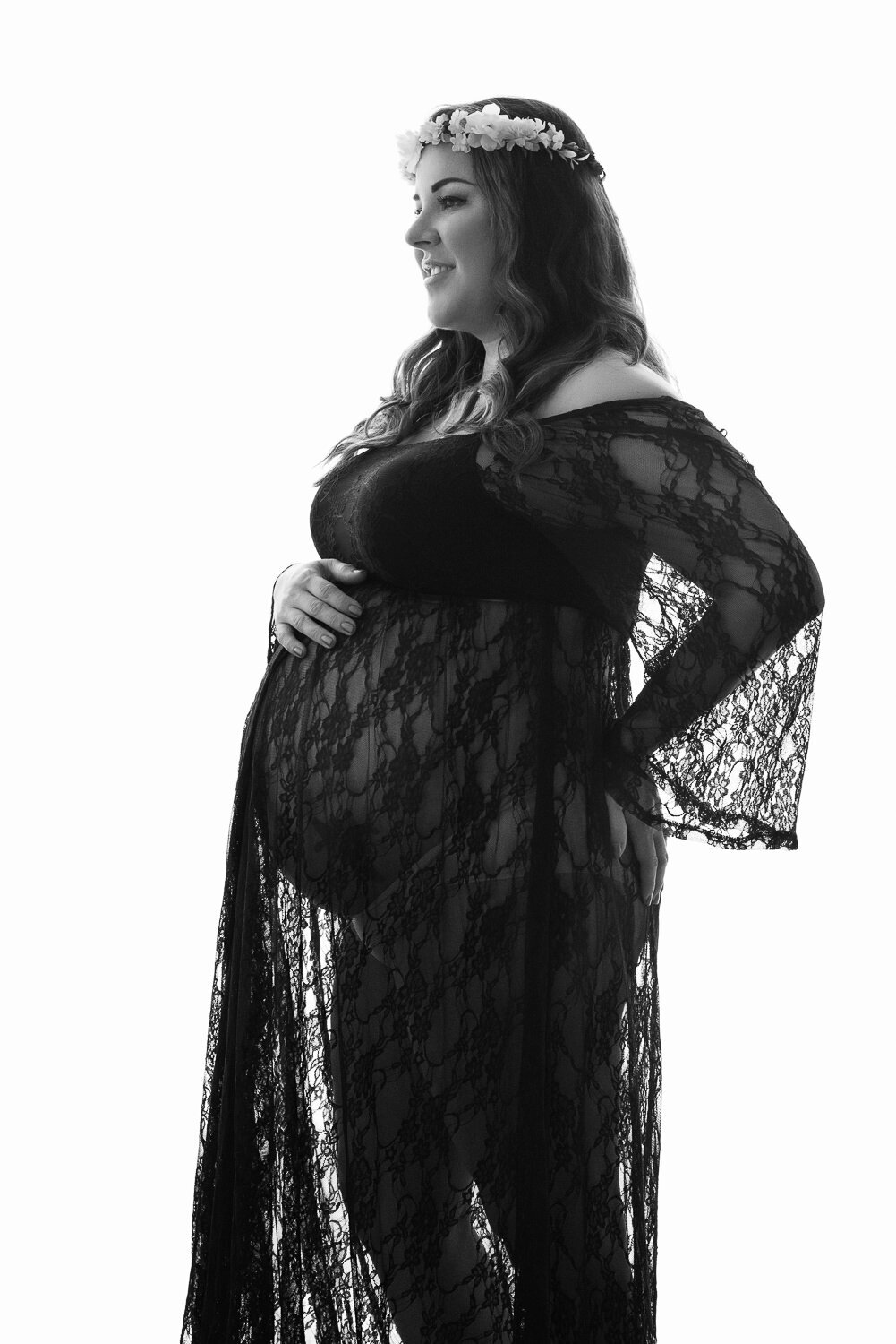 Beautifully styled maternity boudoir session highlighting elegance and maternal confidence at Art of You Portrait Studios, Austin.