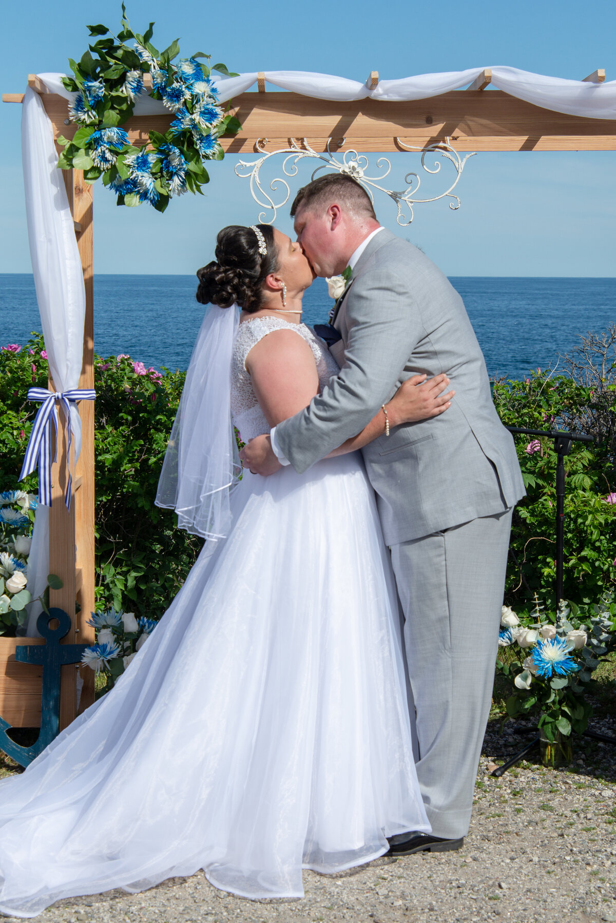 First kiss at Portland Maine wedding at Two Lights State Park