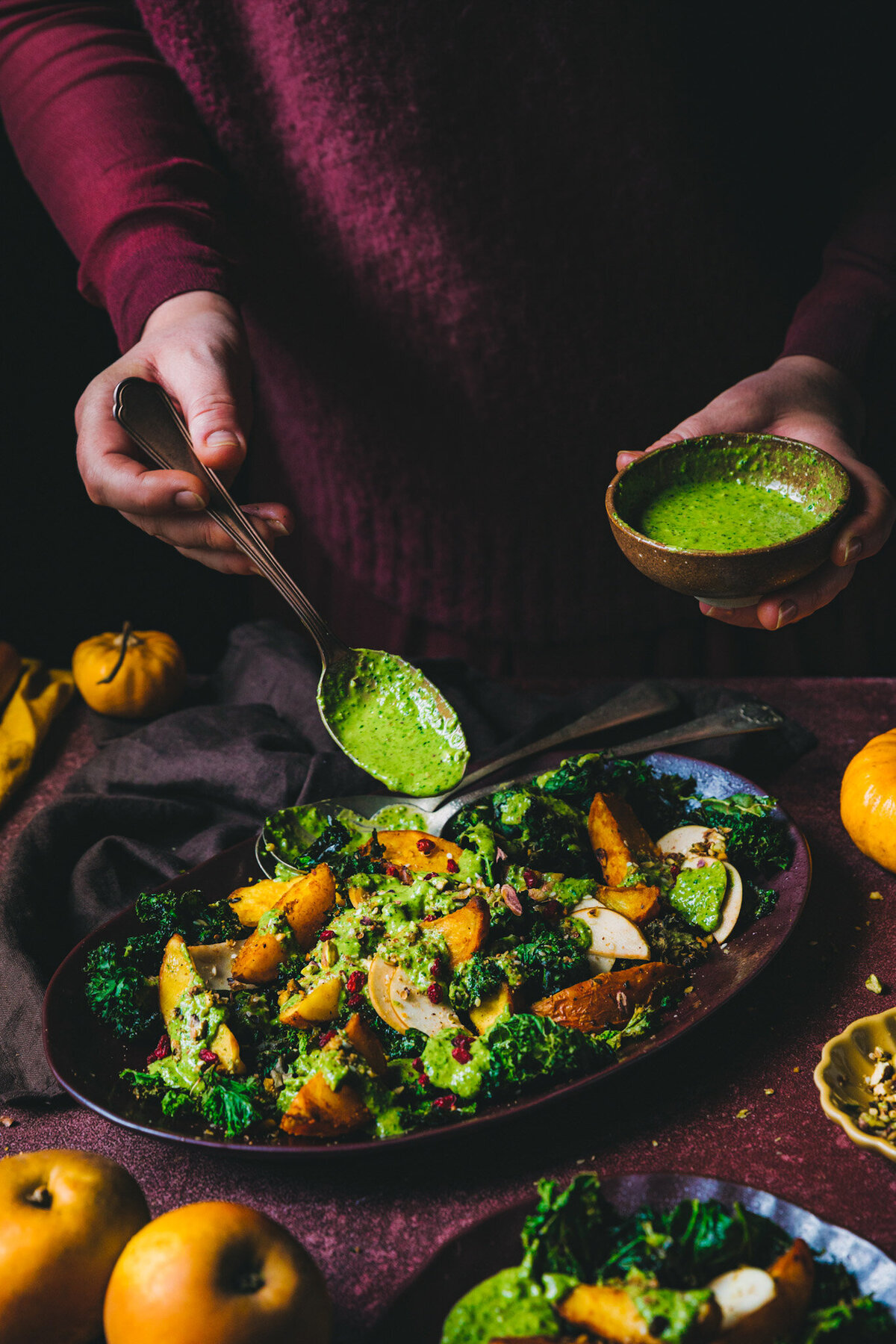 Roasted Turmeric Potatoes on crispy Kale with creamy Kale Tahini Dressing and Pistachio Dukkah