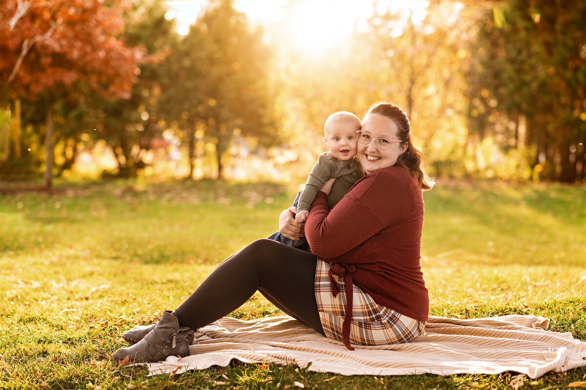 Golden hour outdoor fall portrait of mother and baby | Centennial Park in Ayr, Ontario family photographer