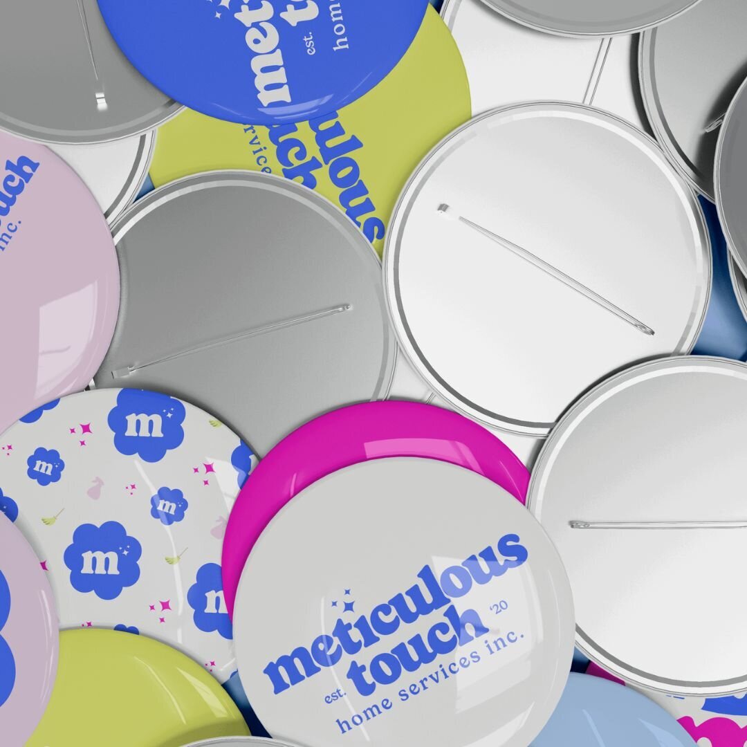 Branded pins for Meticulous Touch Home Services, designed by Mighty Bean Co.
