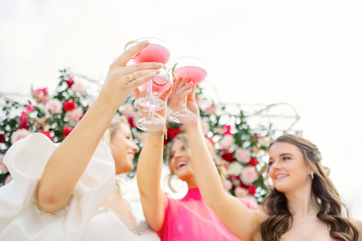 Brides raise pink cocktail