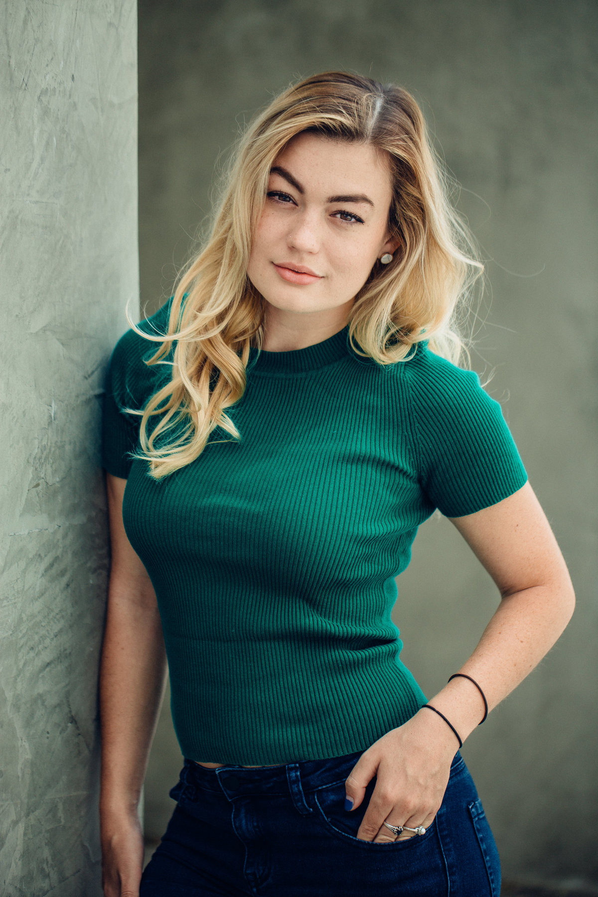 Headshot Photograph Of Young Woman In Dark Green Shirt Los Angeles