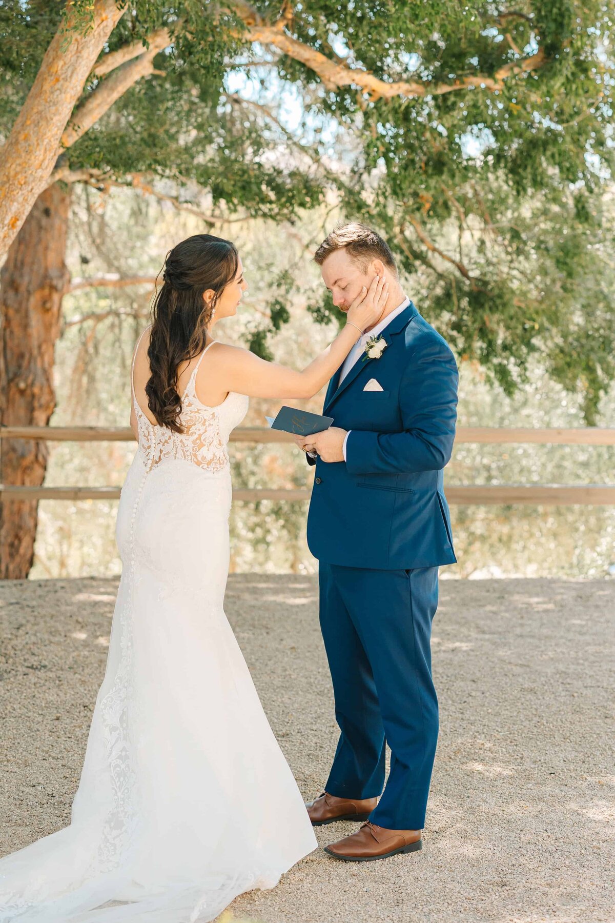 wedding couple exchanges vows during their first-look before their fresno wedding ceremony