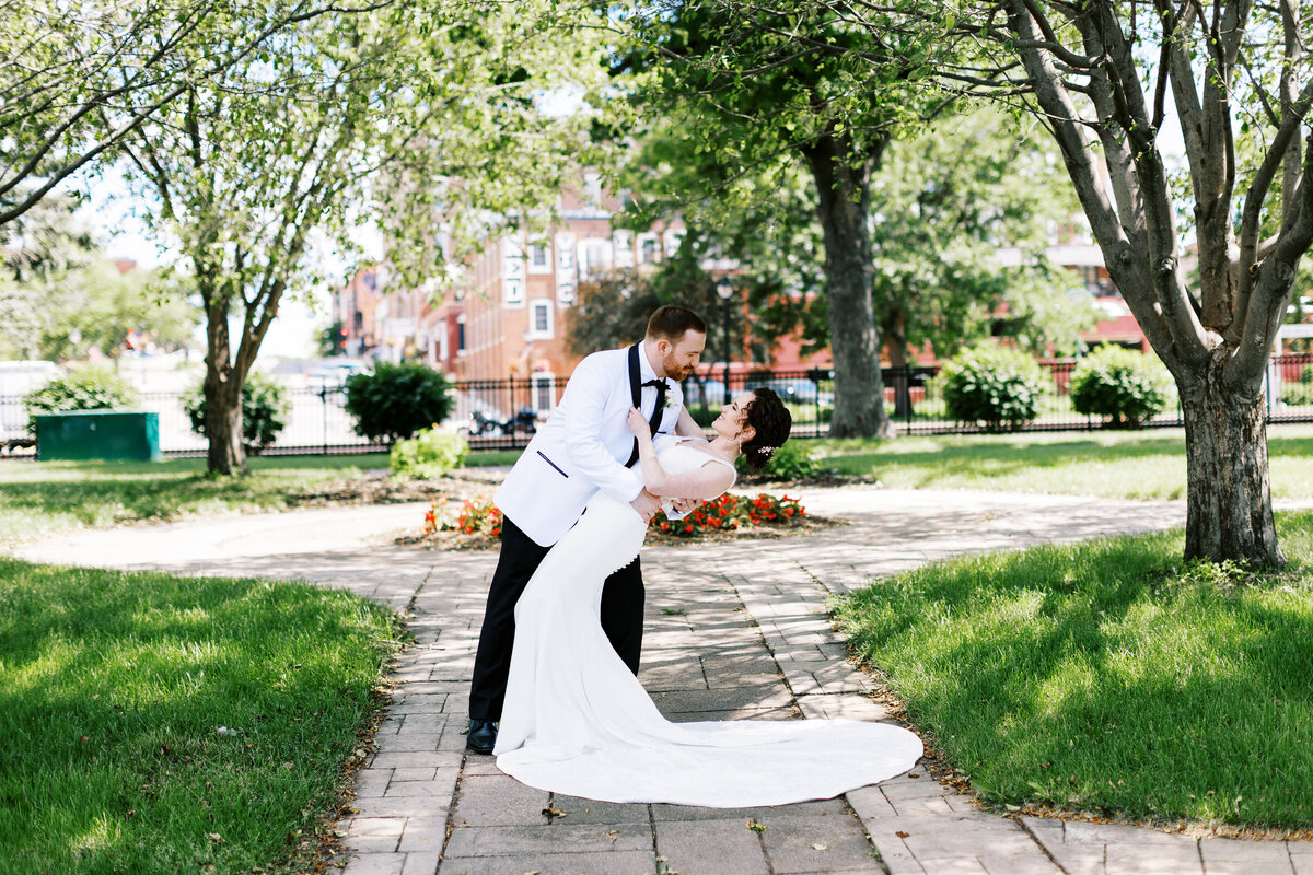 groom dipping his bride for a kiss