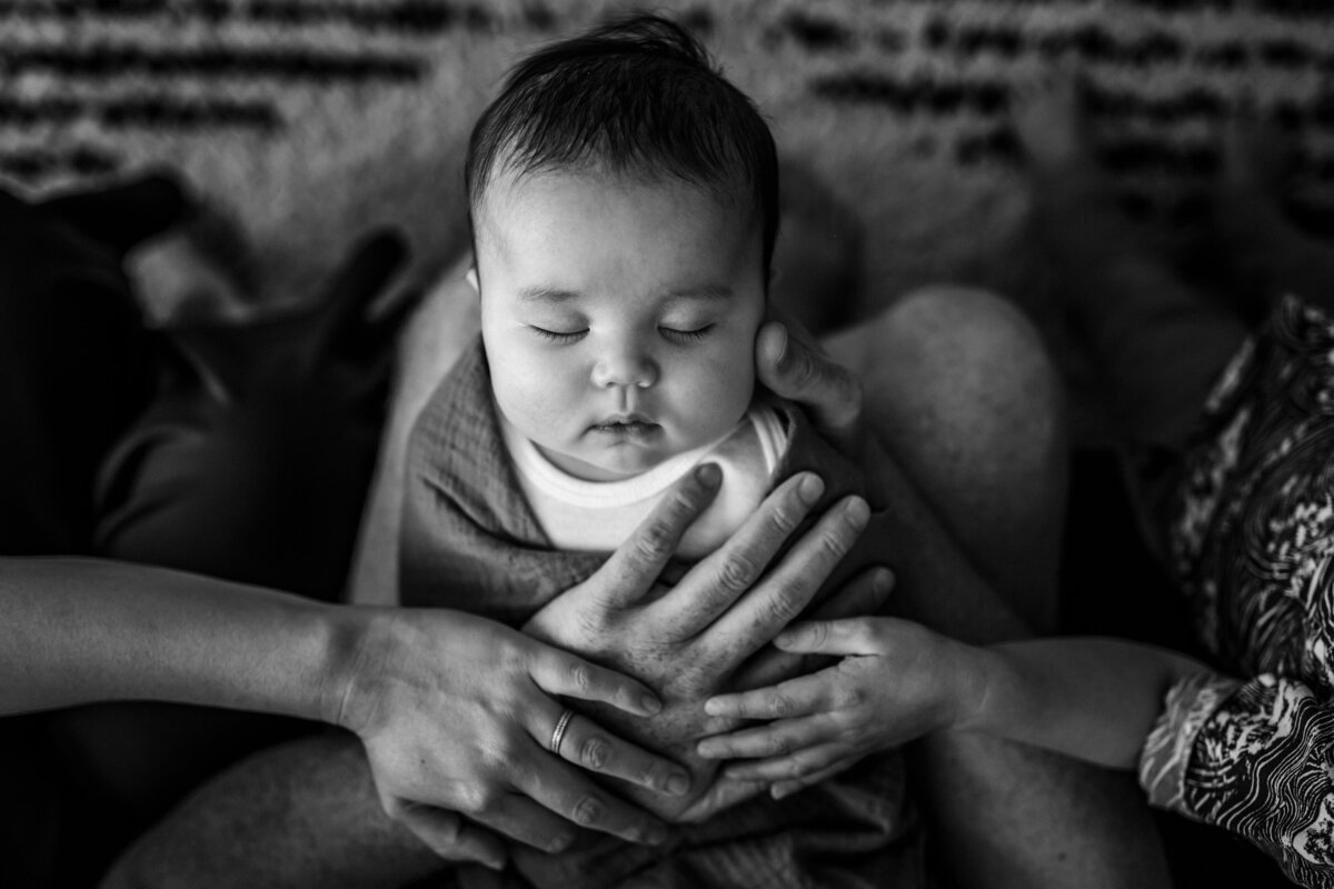 sleeping-baby-parent-hands