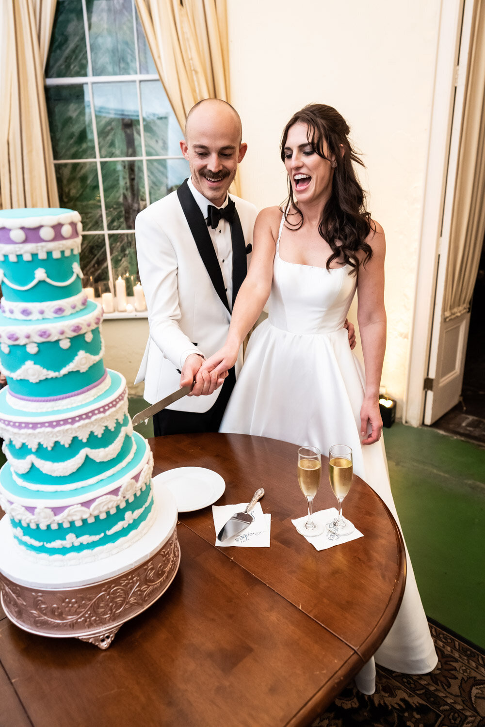 Bride and groom cutting cake