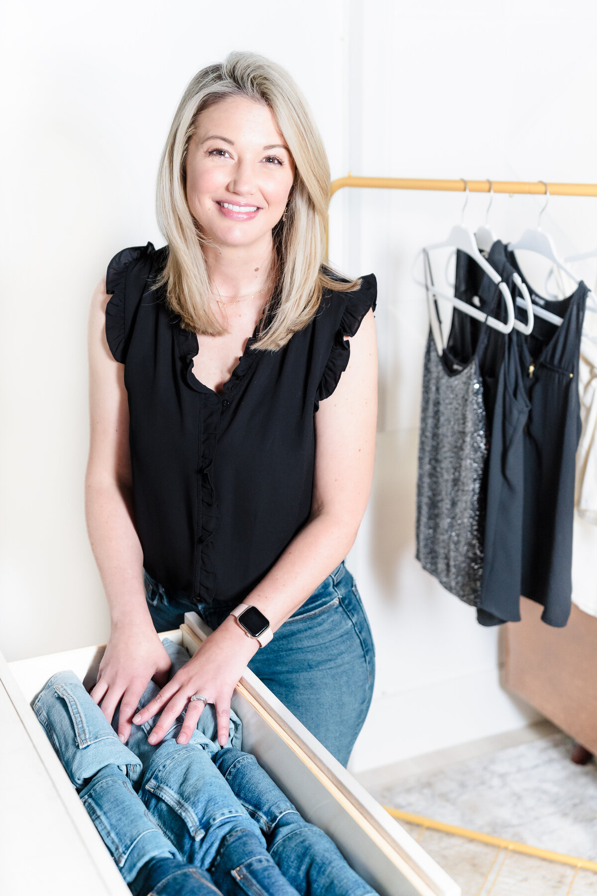 brand photo of a professional organizer organizing a clothing drawer