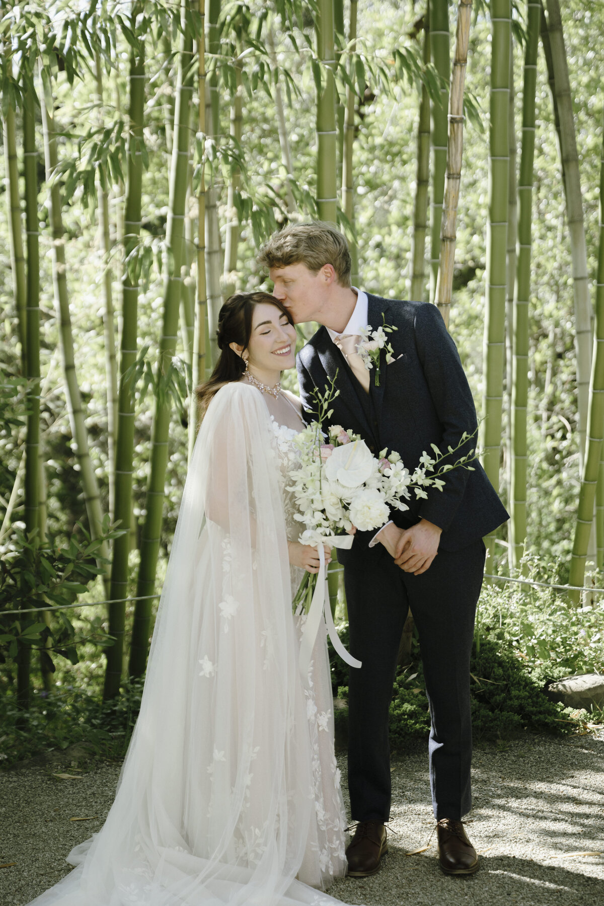 Bride and Groom posing in tea garden