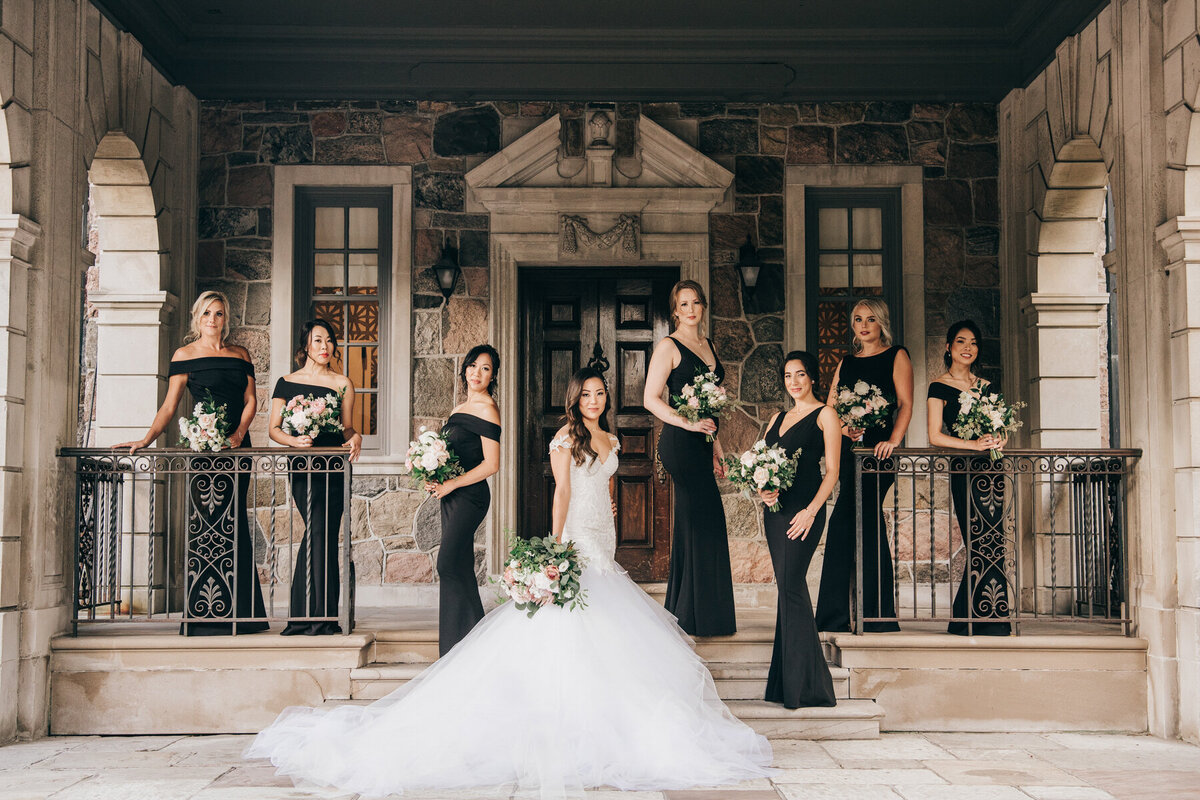 Luxurious bridal portraits of bride and bridesmaids dressed in black