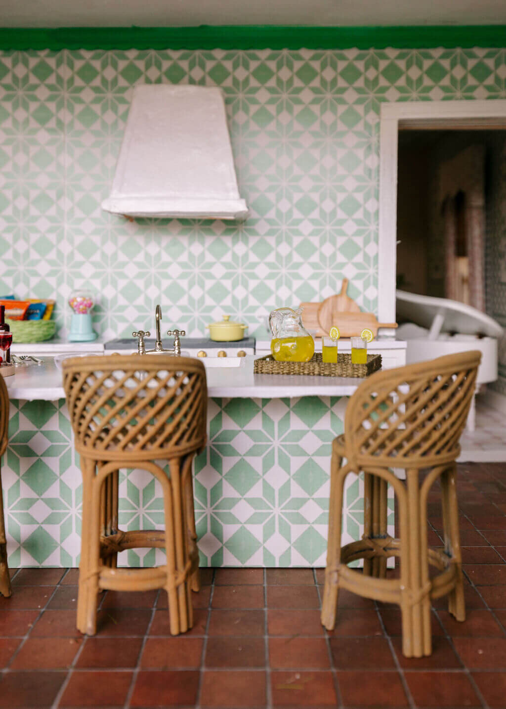 oyster creek studios petite palm beach dollhouse wicker stools at bar area in kitchen