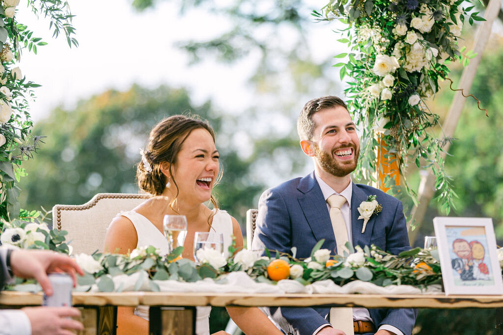 couple-laughing-sweetheart-table-decor