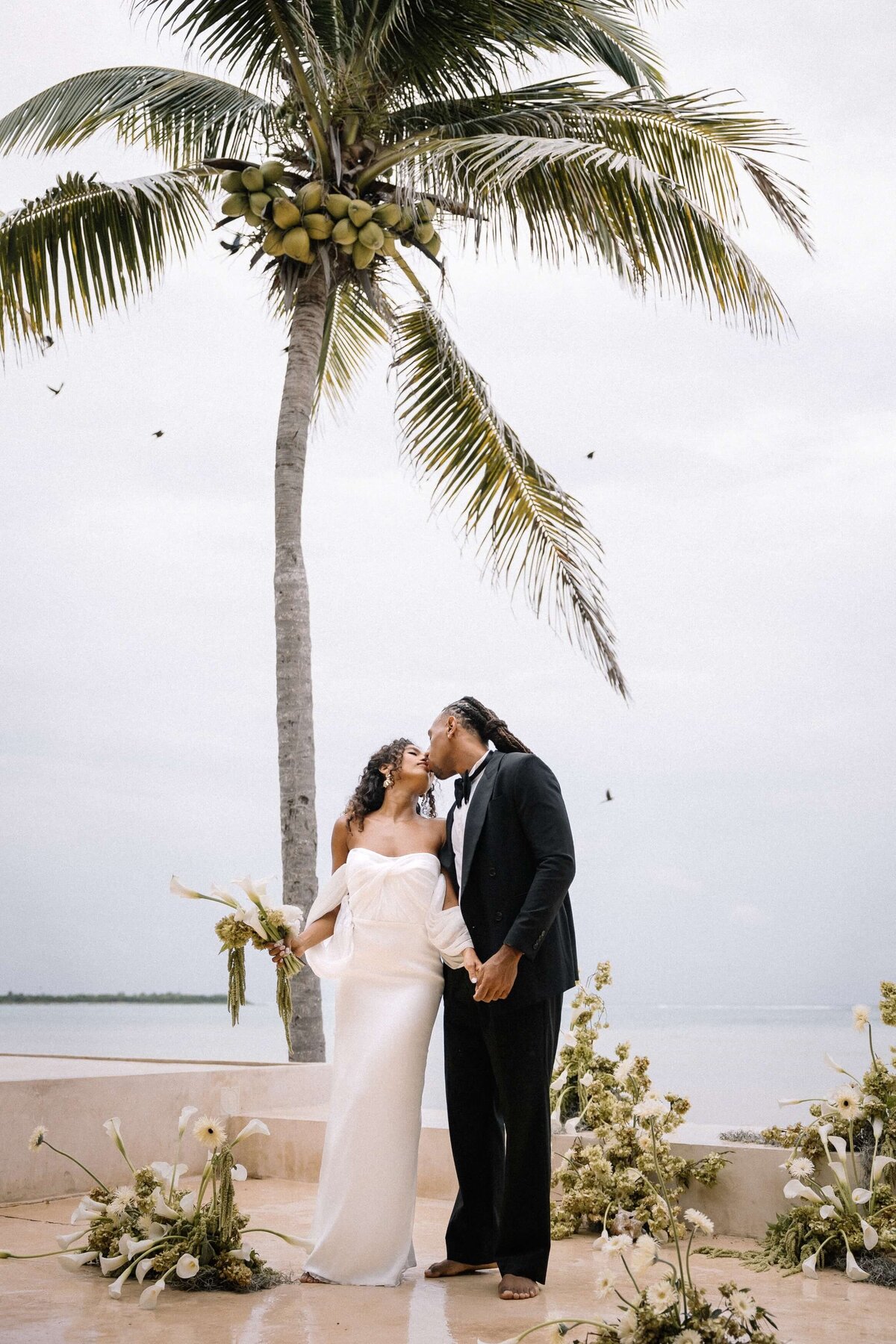 couple-kissing-on-beach-nika-helgeson-photography