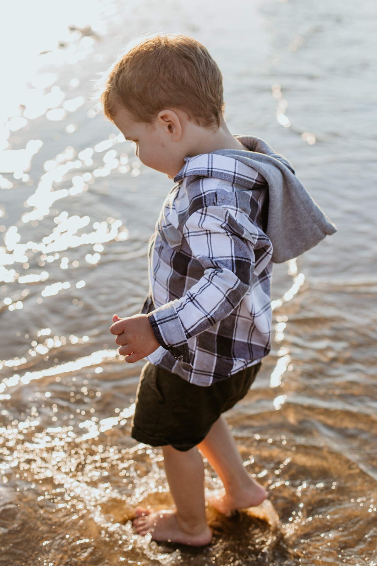 Fun moments of a little boy jumping on the waves.