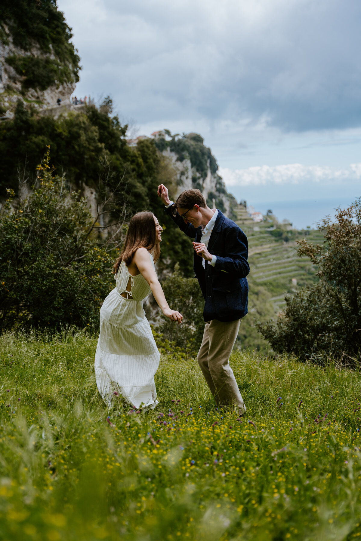 Couple dancing in a grassy field