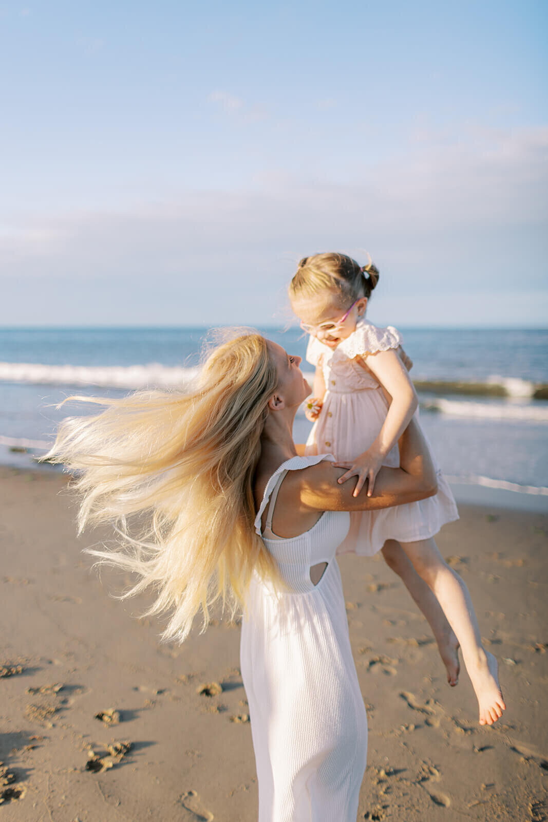 woman-picks-up-child