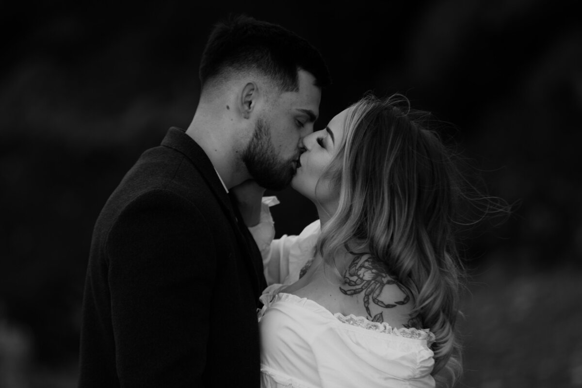 black and white image couple kissing