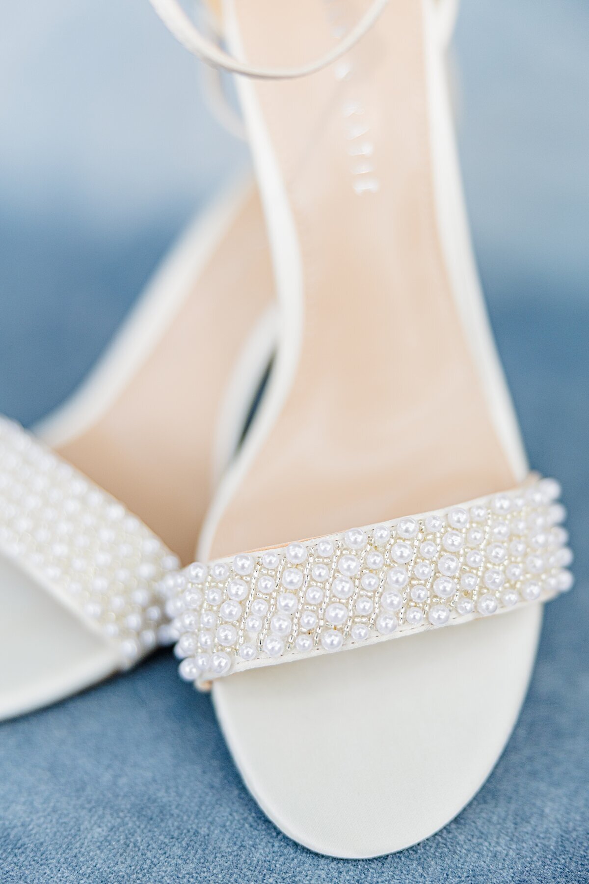 pearl-wedding-shoes-on-blue-backdrop