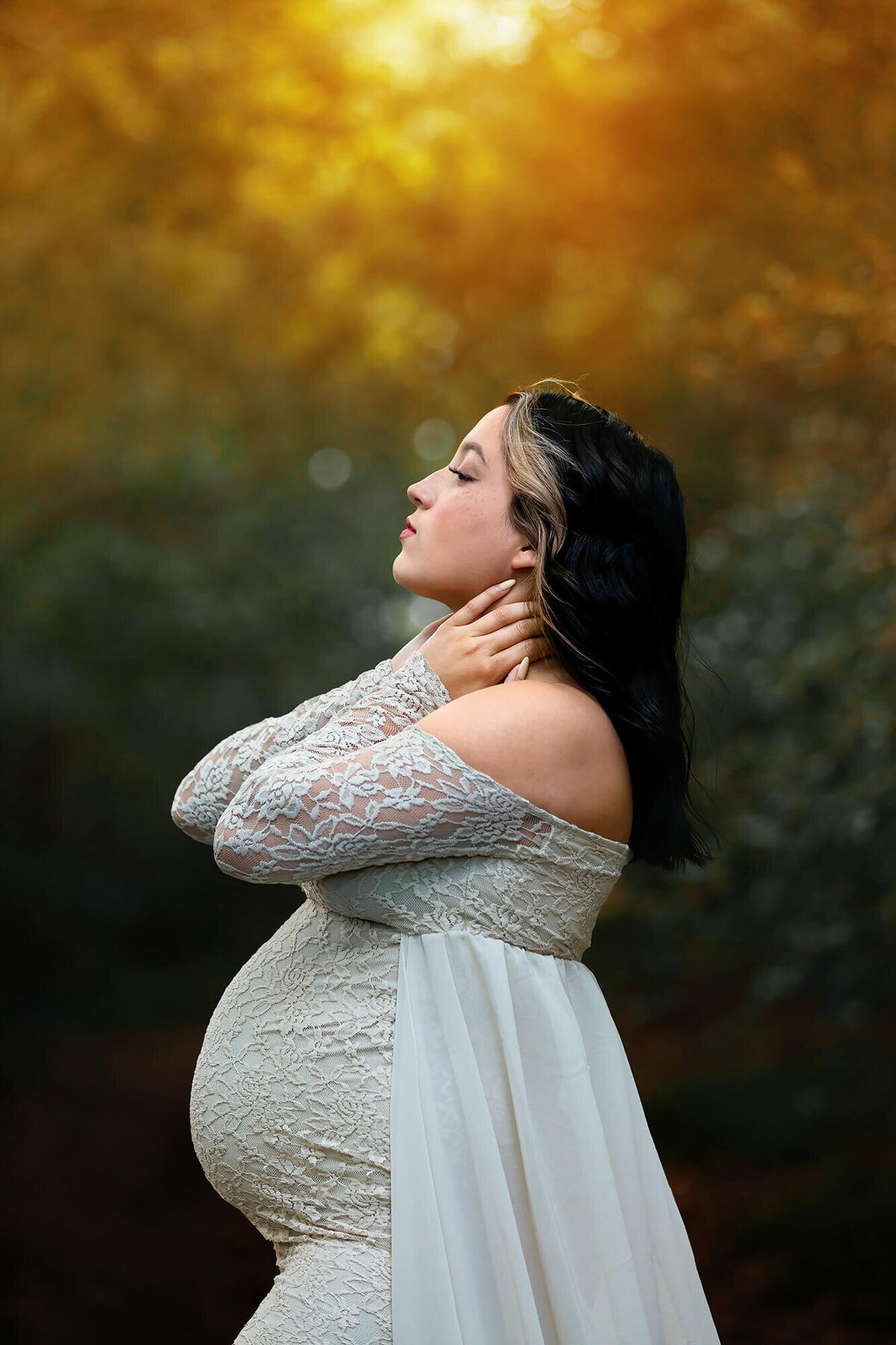 Beautiful mom to be posing during her Houston Maternity Photography Session by Danielle Dott.