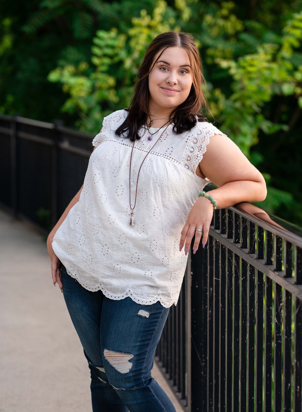 Celebrate your high school senior with personalized portrait sessions, including cap and gown photos, by Leslie Q Photography. Offering both studio and outdoor options to capture their unique personality and milestone. Serving Michiana, Northern Indiana, South Bend, New Carlisle, and surrounding areas.
