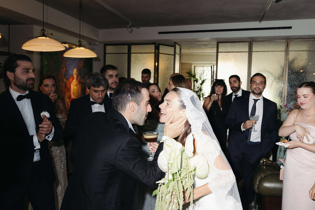 Bride dancing joyfully on striped floor at Soho House Rome

