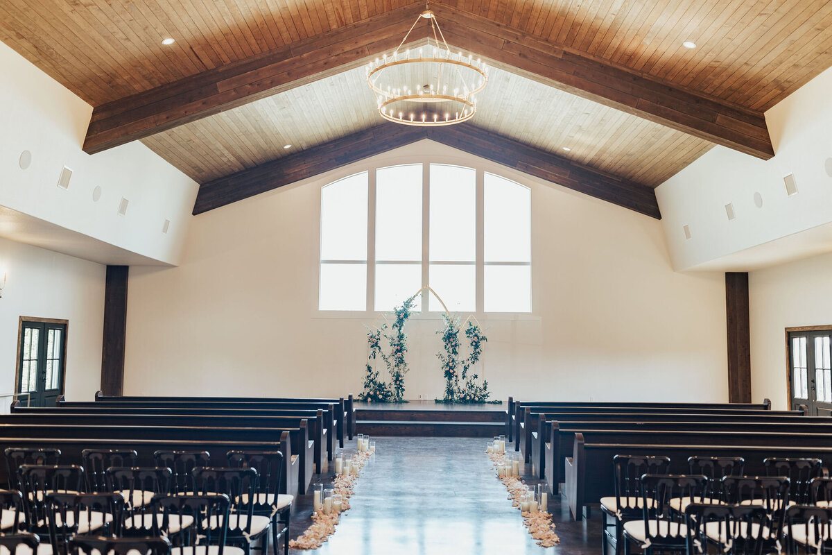couple kissing in front of wedding party at Texas Hill Country wedding venue