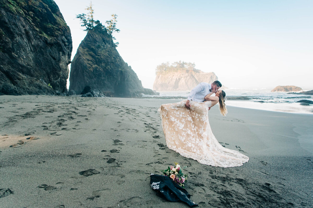 Dip and kiss for Secret Beach Elopement