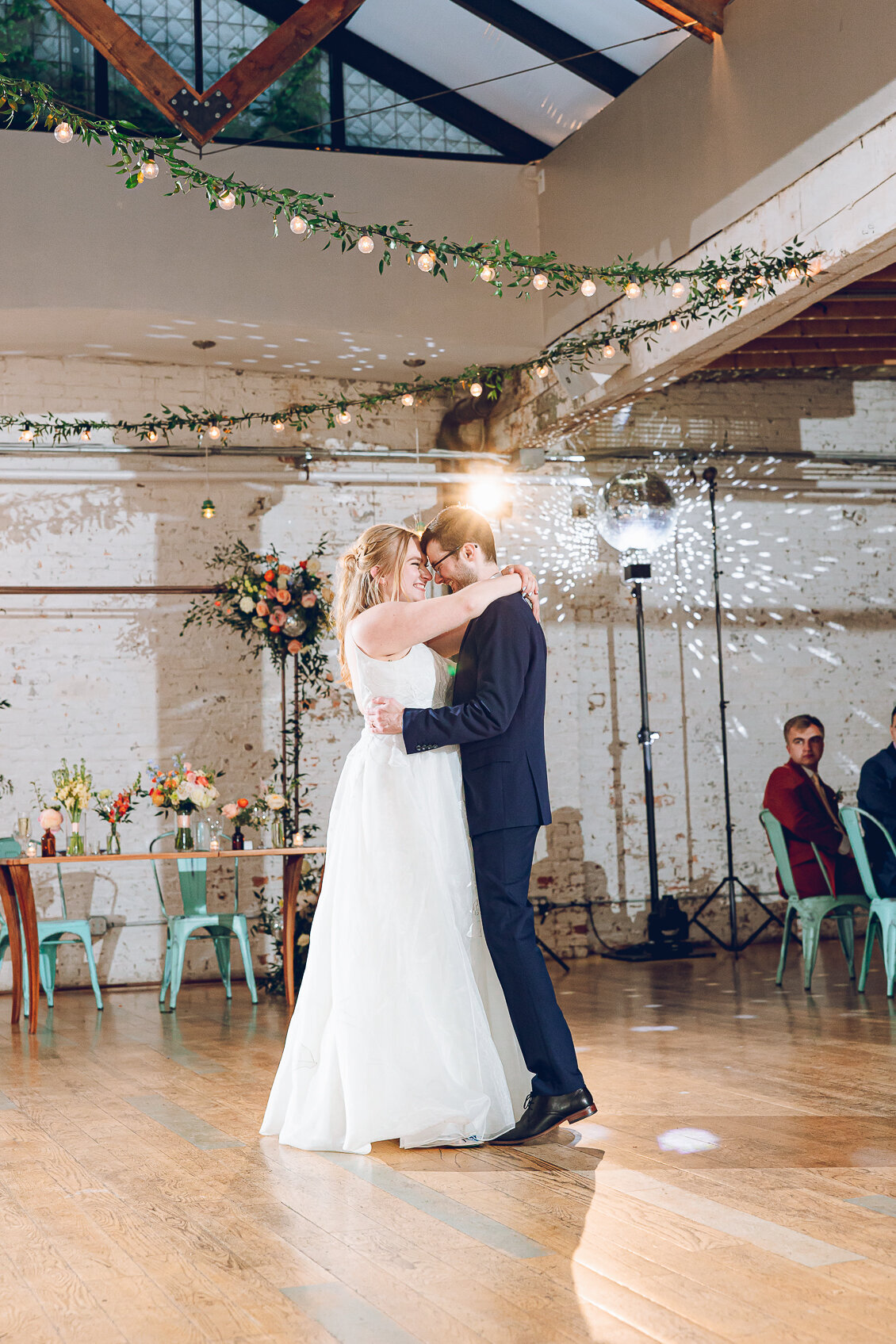 A couple shares their first dance at The Joinery in Chicago