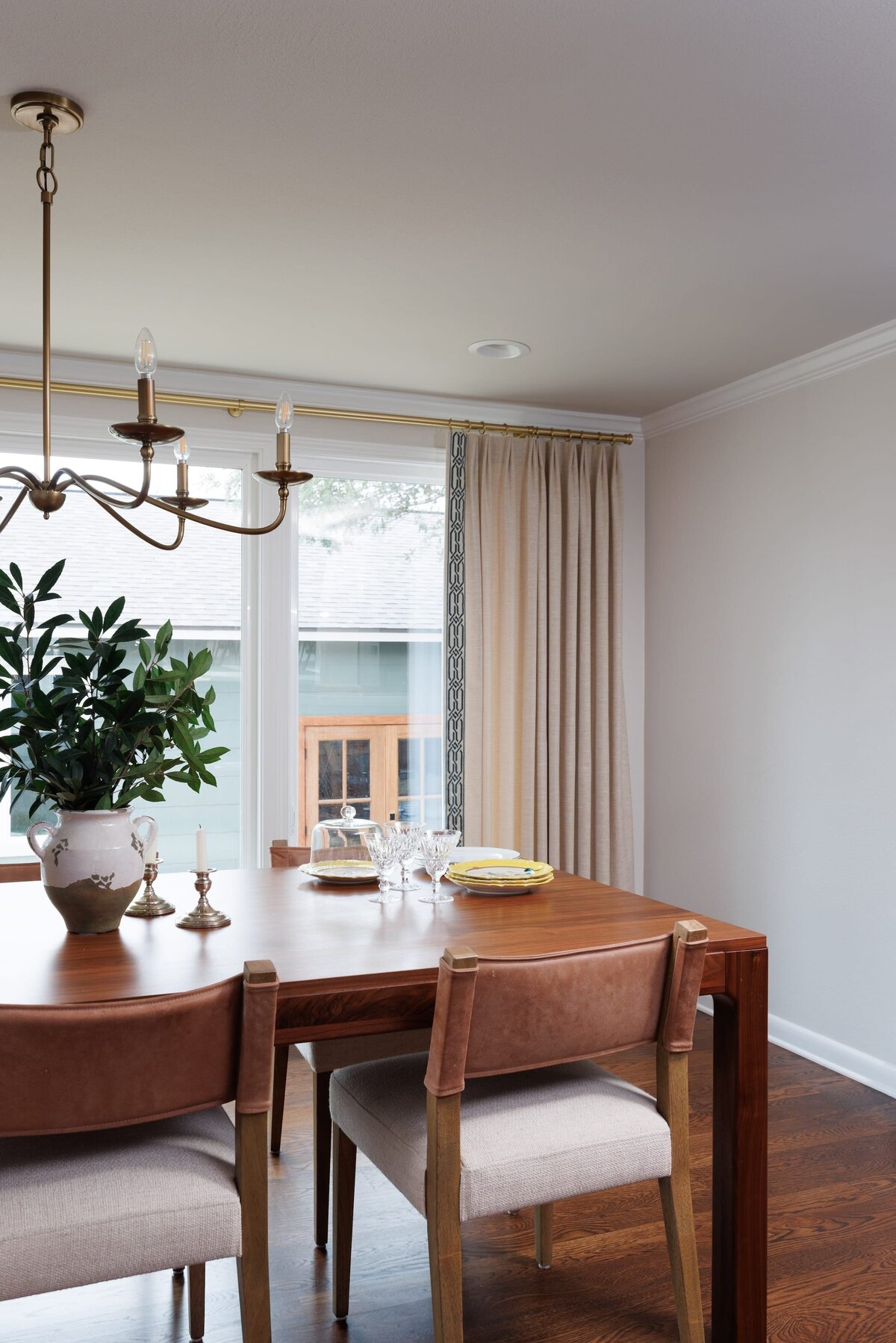 the keeping room interiors oakview dining room with green plant in vase on table