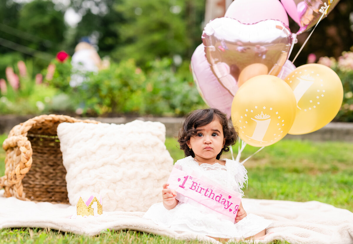 one year old baby girl with balloons