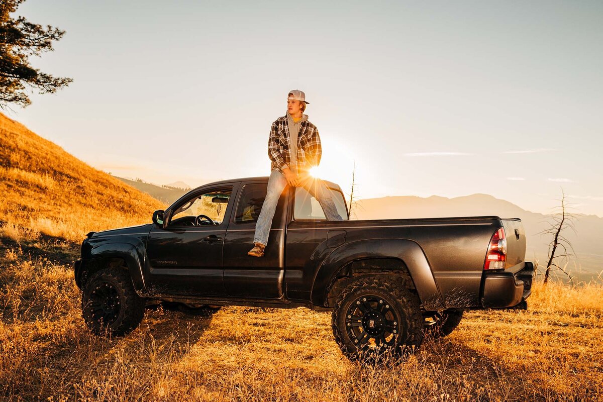 Montana senior picture boy sitting on truck at sunset, Hamilton, MT