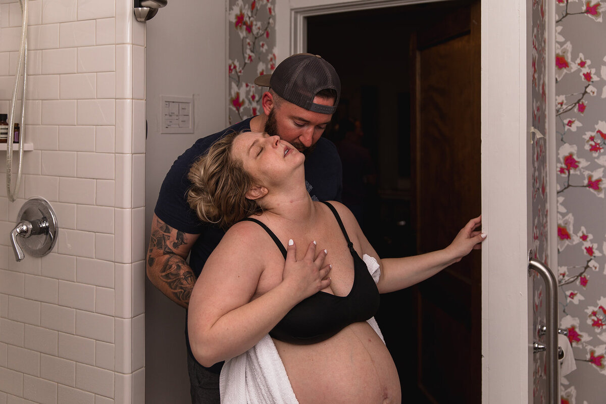 Husband Holds Laboring Wife Between Contractions