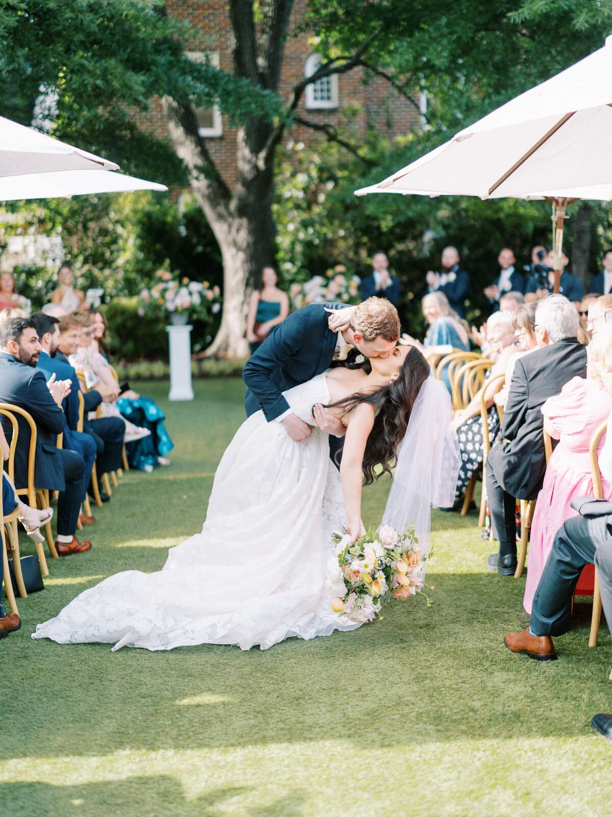 A bride and groom kissing in Raleigh North Carolina