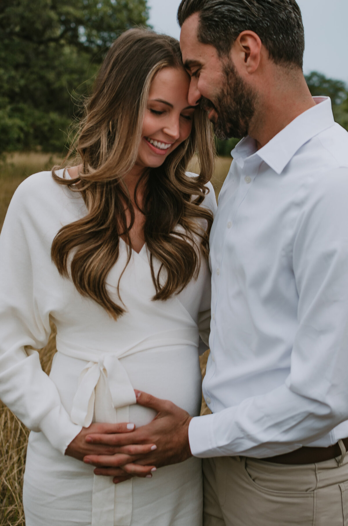 husband-holding-pregnant-wife-photoshoot-austin