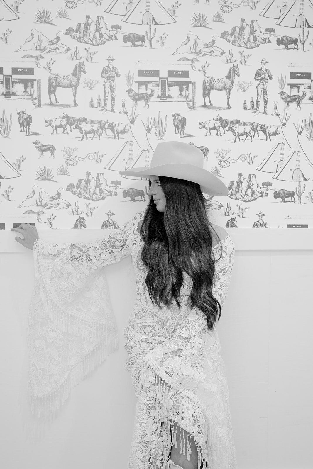 Black and white bridal portrait with western-inspired wallpaper at The Videre Estate in Austin, Texas.