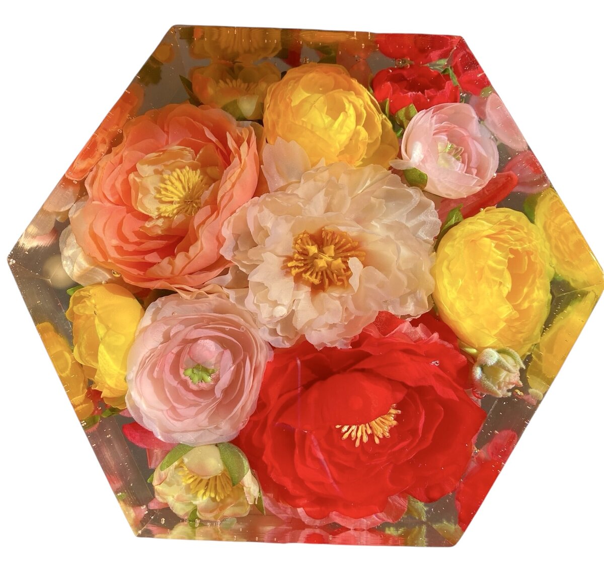 hexagon resin block with bright pink and orange red and yellow silk wedding flowers preserved as a family heirloom